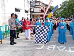 Kapolsek Babat Pimpin Pengamanan dan Pelepasan Lomba Gerak Jalan Tingkat SDN dan MI